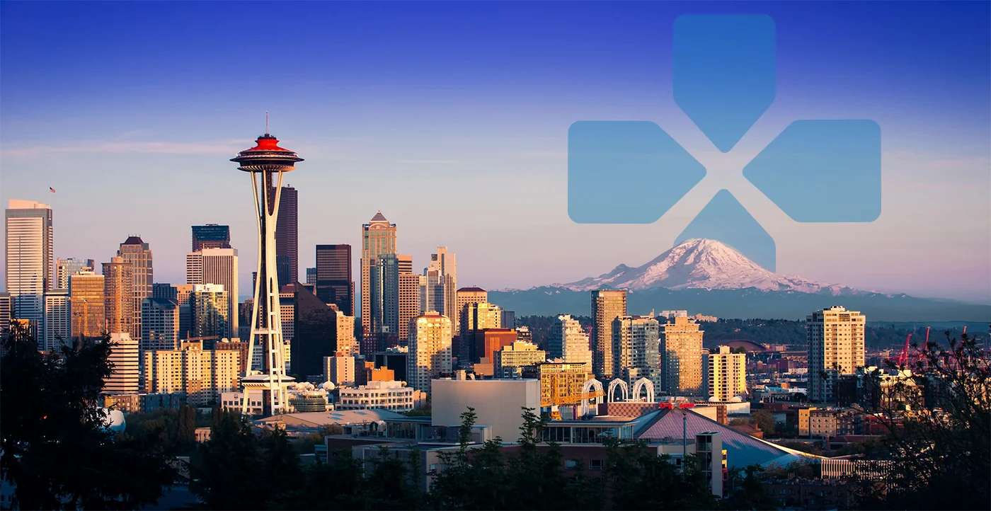 Seattle skyline with PAX logo behind Mt Rainier